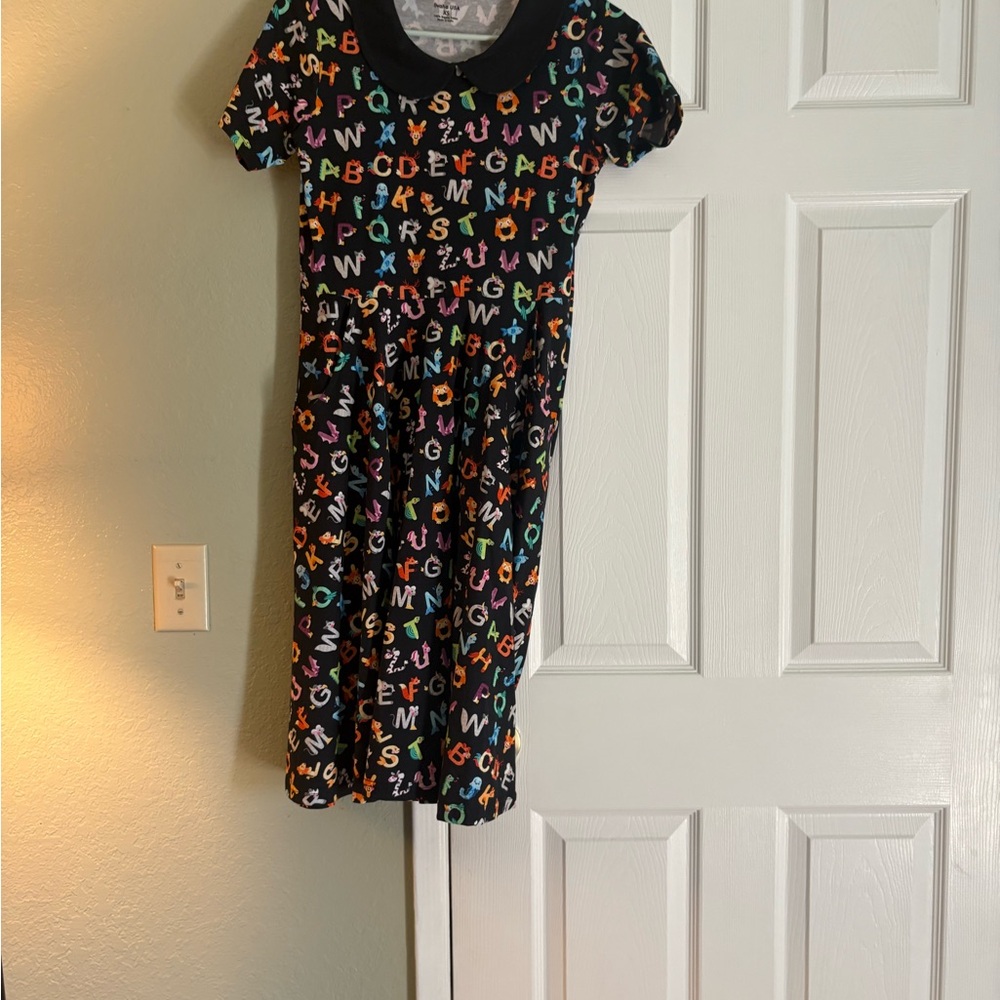 Colorful Alphabet Dress with deep pockets and a Peter Pan collar